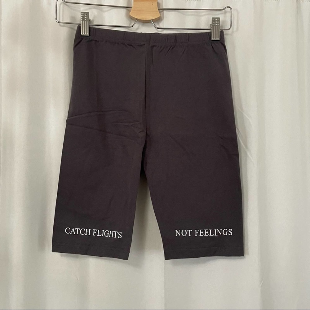 Brand new “catch flights not feelings” dark grey biker shorts size medium